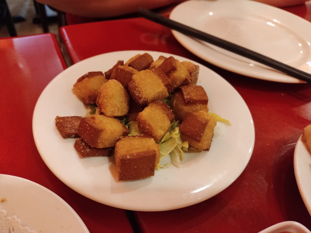 A plate with small chunks of ribs - a pale and chewy centre between two darker, crispier edges