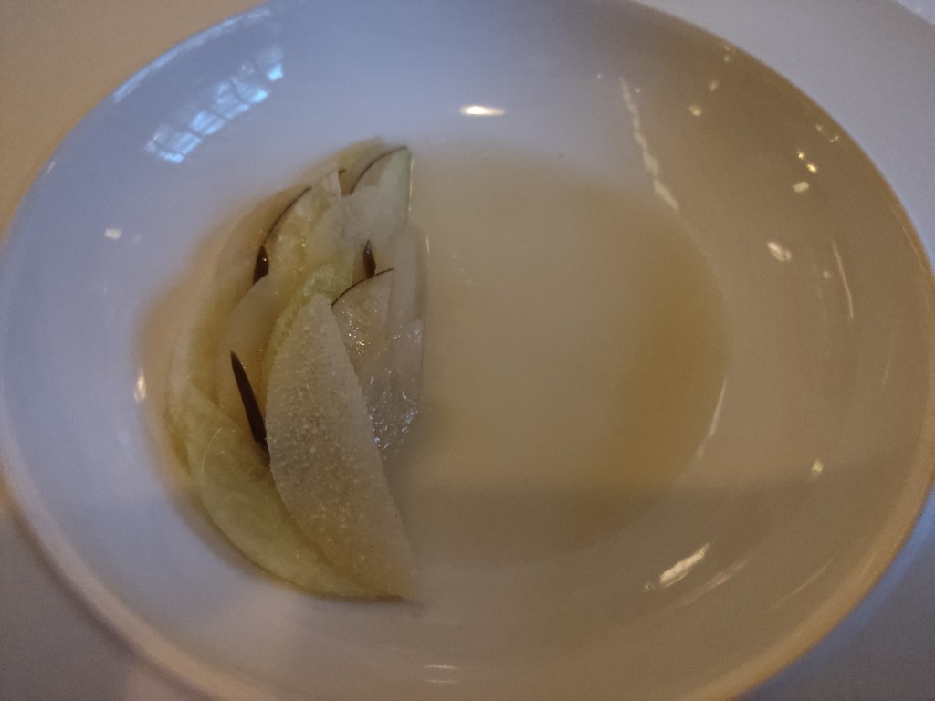 Artfully arranged slices of radish and fennel in a cream sauce