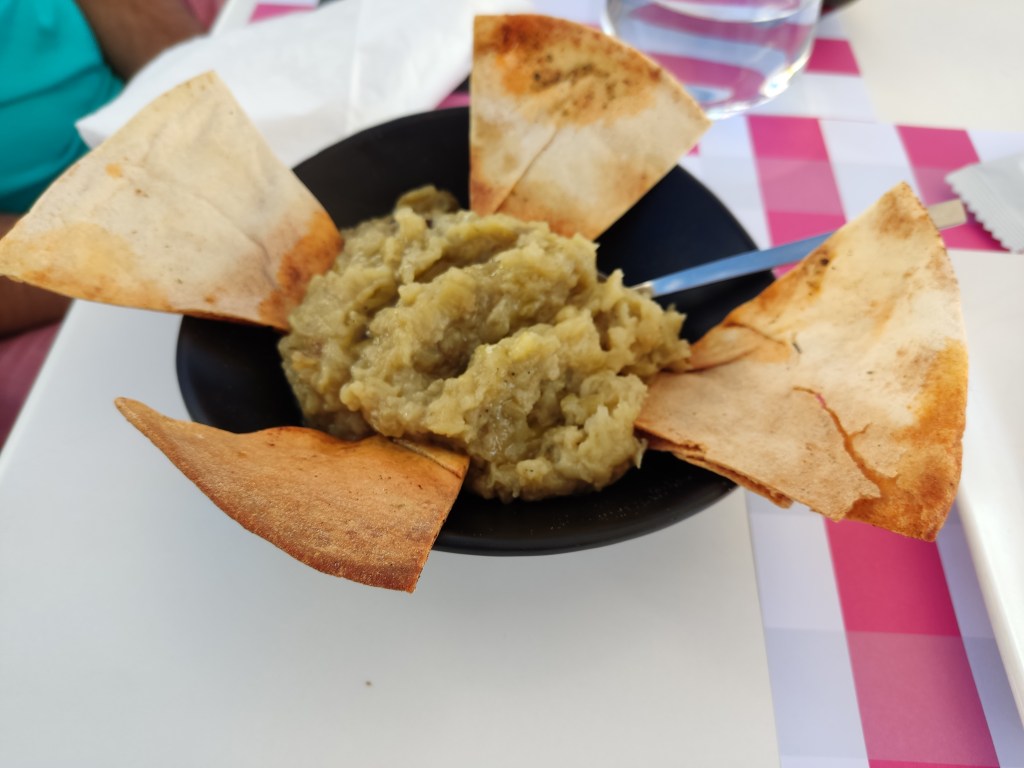 Baba ganoush with four small shards of toasted pita