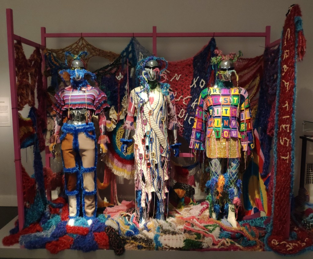 An exhibition from the museum with some outfits in a variety of textiles