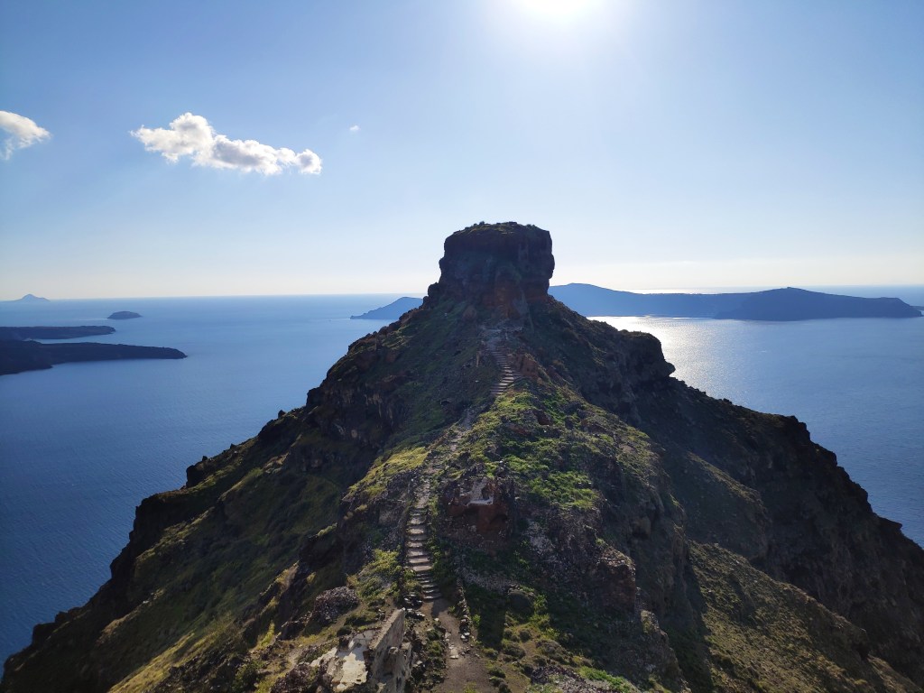 Skaros Rock against a blue sea and blue sky