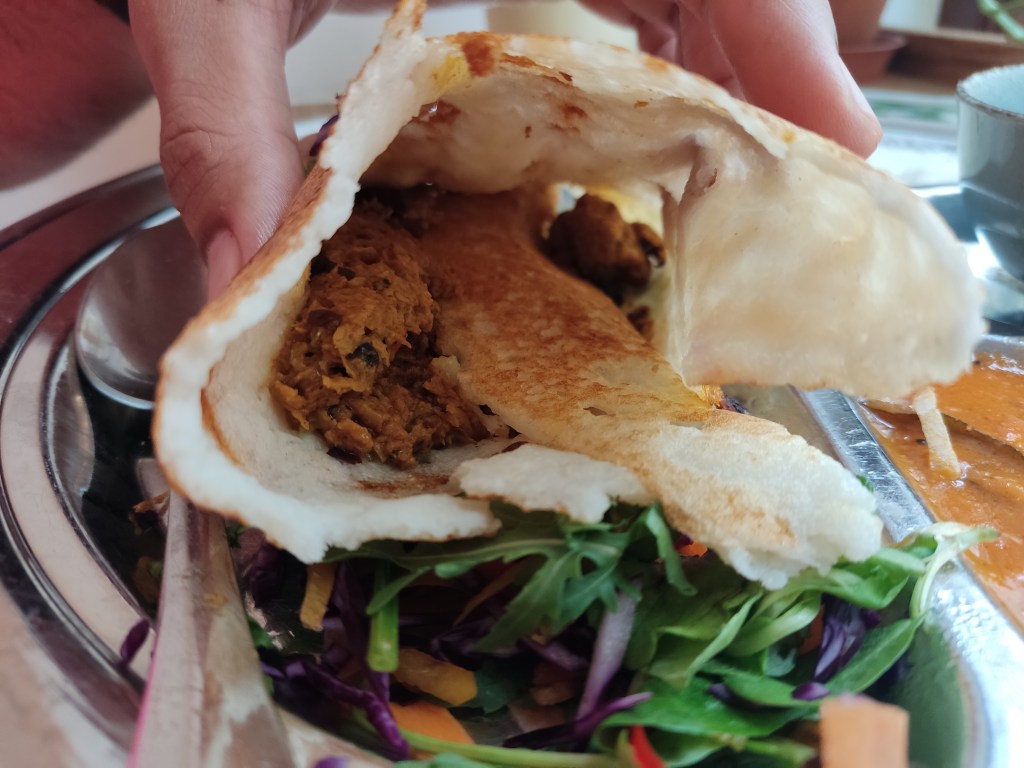 The inside of a dosa filled with soy mince