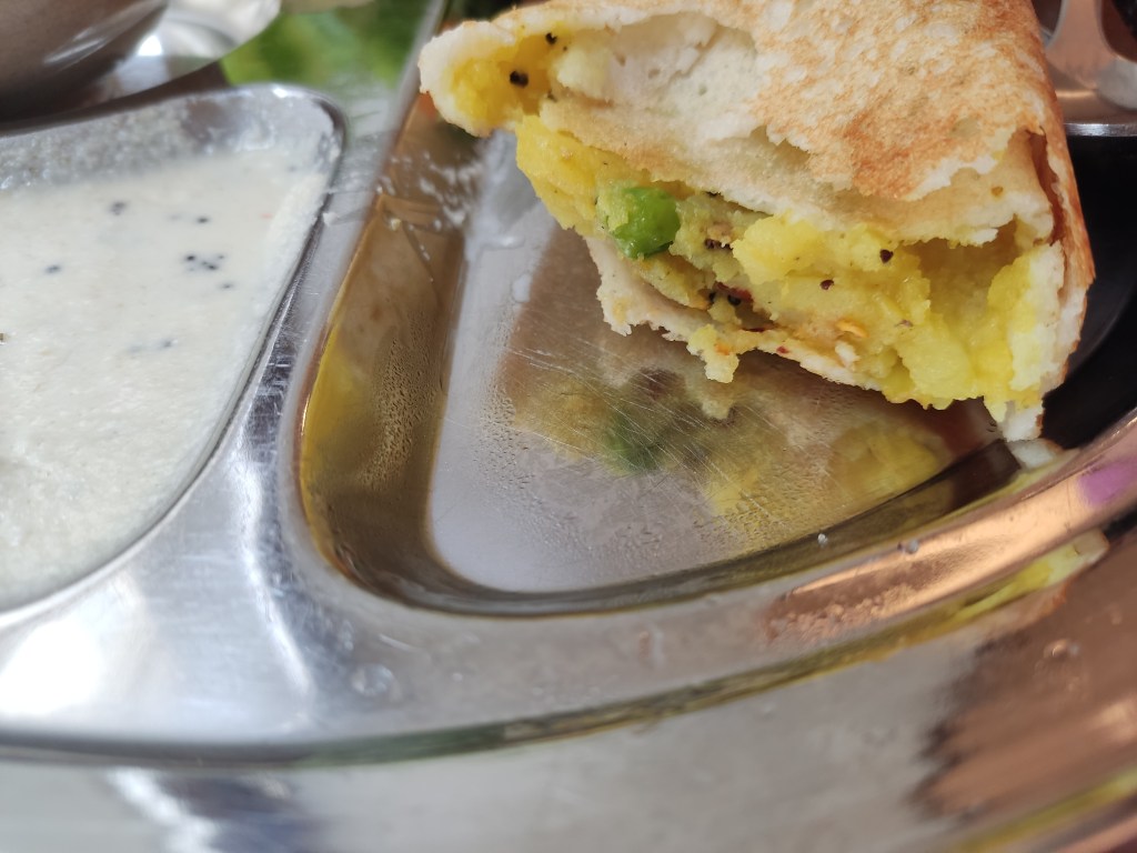 The inside of a dosa filled with potato