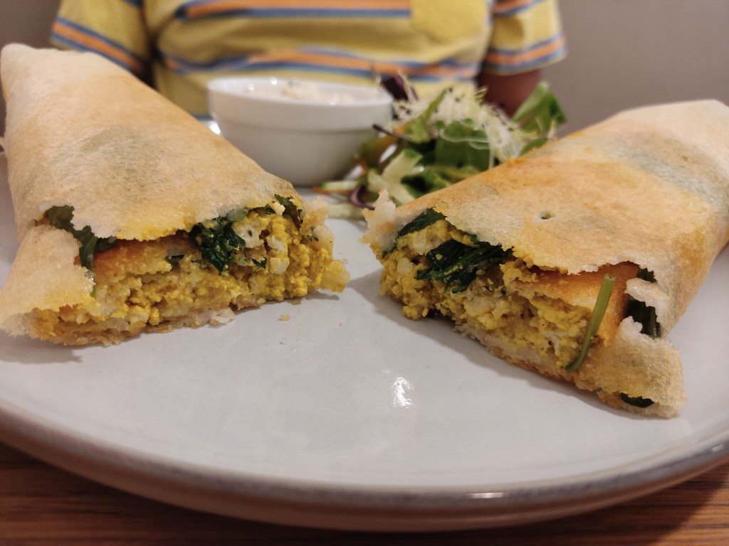 The inside of a dosa filled with tofu scramble