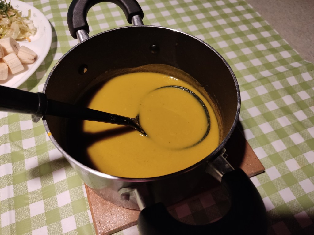 A pot of yellow soup