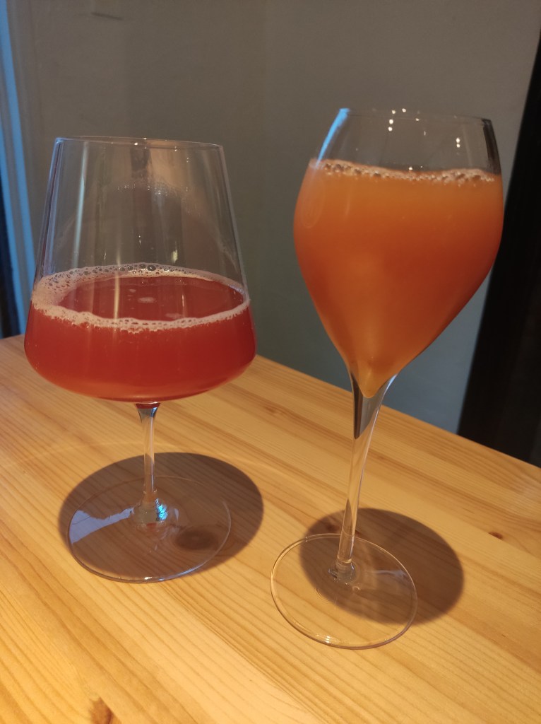 A red drink and an orange one