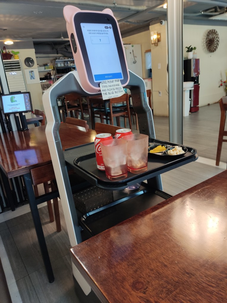 Drinks and banchan delivered by a robot waiter