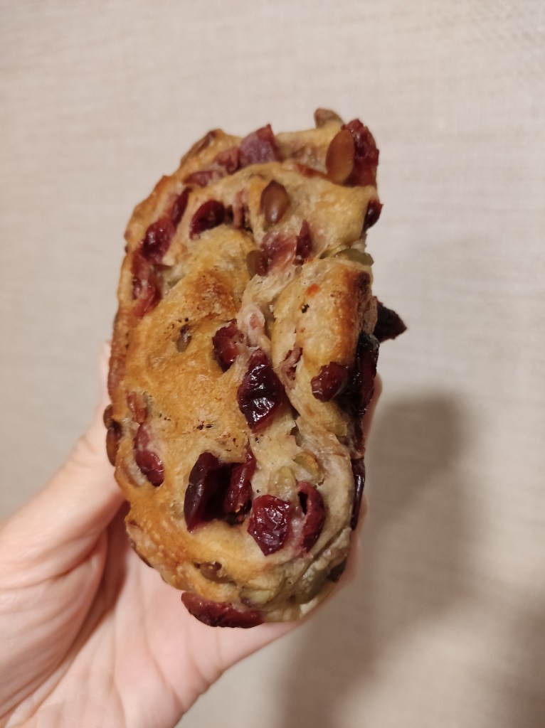 Small ciabatta bun with juicy cranberries and pistachios