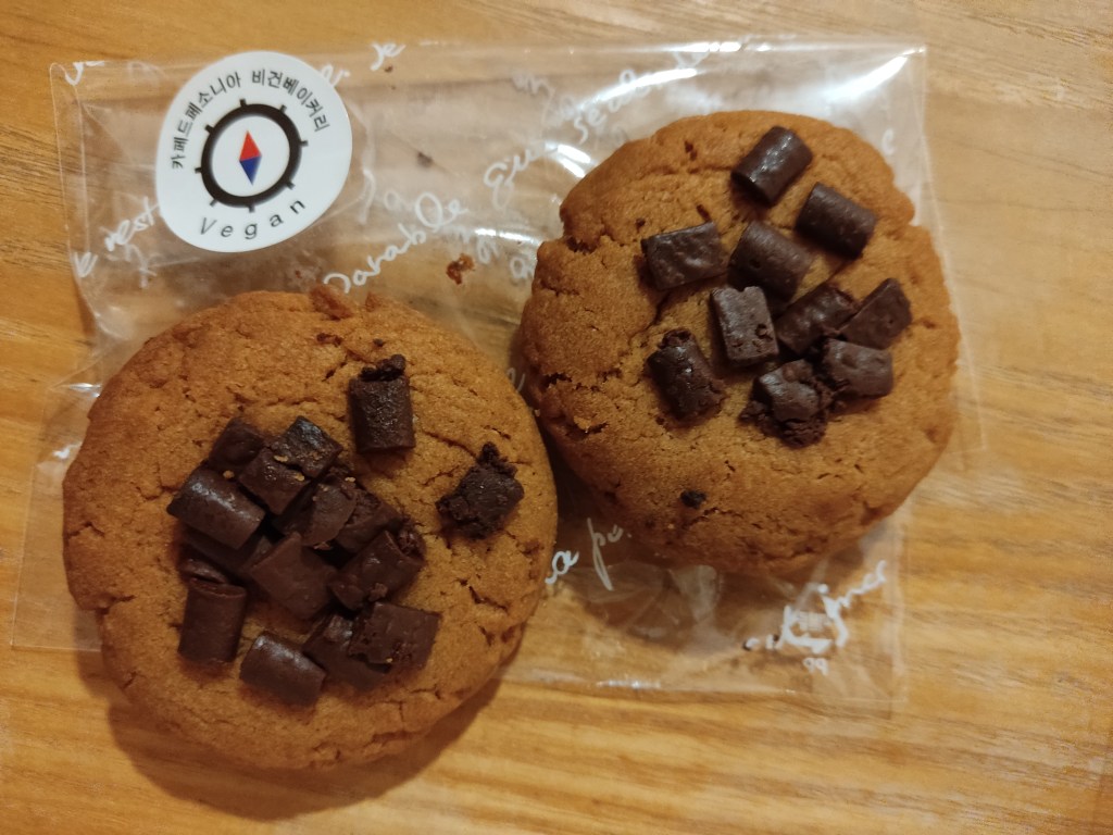 Two cookies with chocolate chunks in the middle