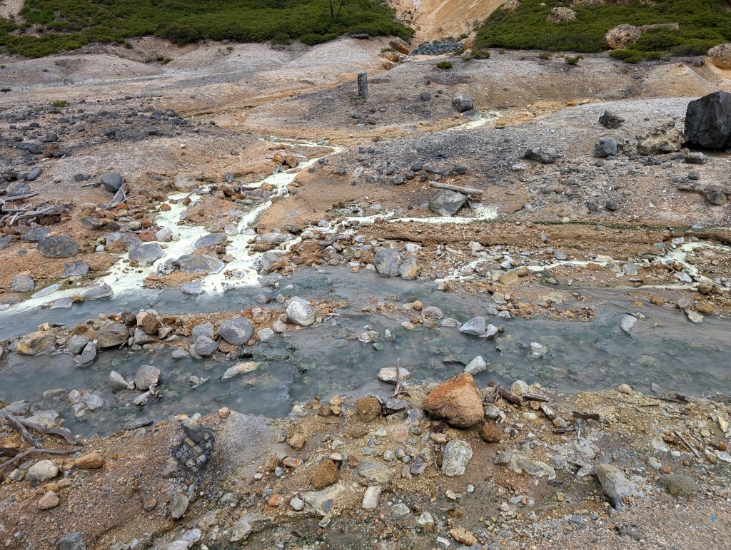 A stream through the rocky ground of the geothermal park