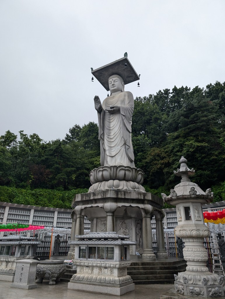 A tall statue at the temple