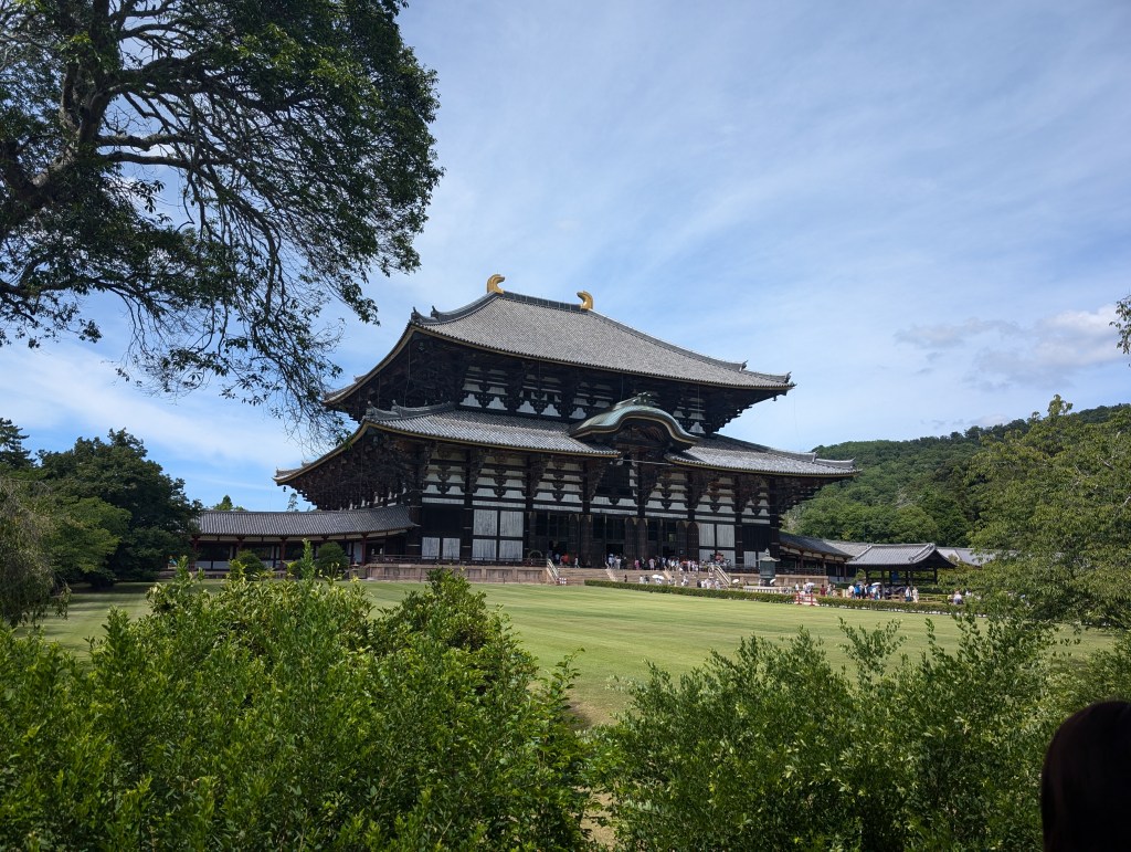 An enormous white and brown temple building which houses the giant Buddha statue