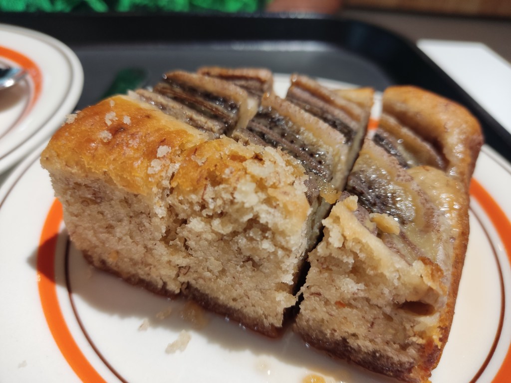 Banana cake in three small slices with a syrupy sticky bottom