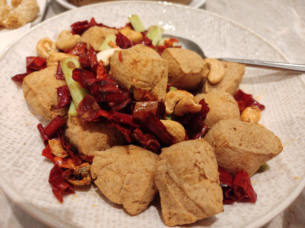 Chunks of hard looking stinky tofu with lots of red chillies and cashews