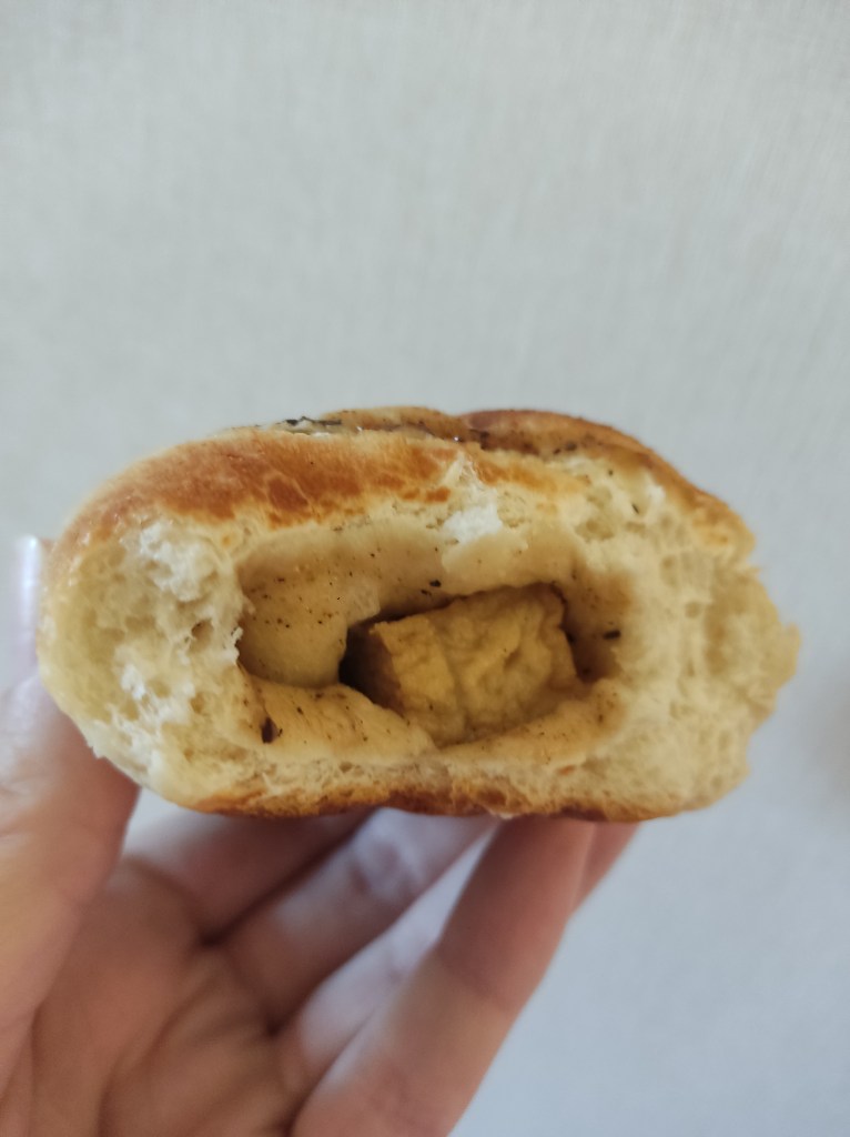 Inside a bun with chunks of tofu
