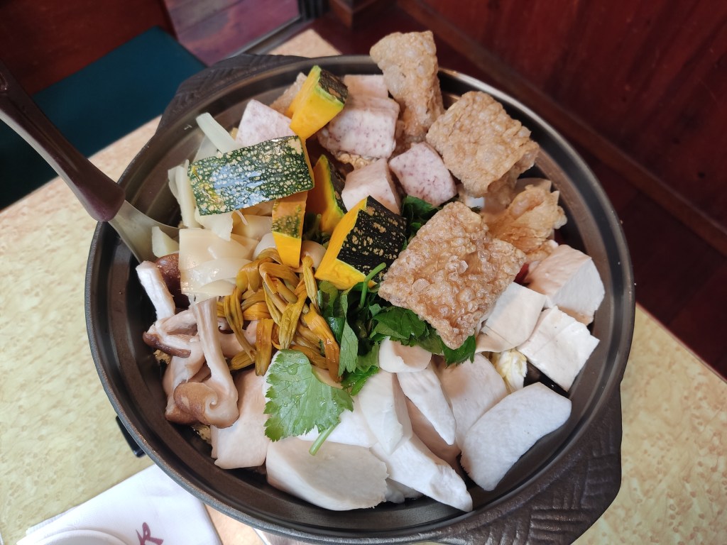 A hot pot that has not yet been cooked, with mushroom, vegetables and tofu