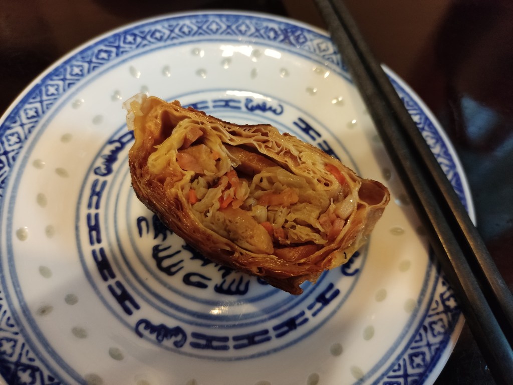A bean curd roll stuffed with vegetables