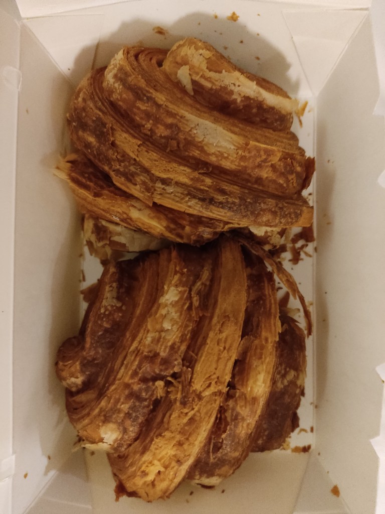 Two flaky croissants