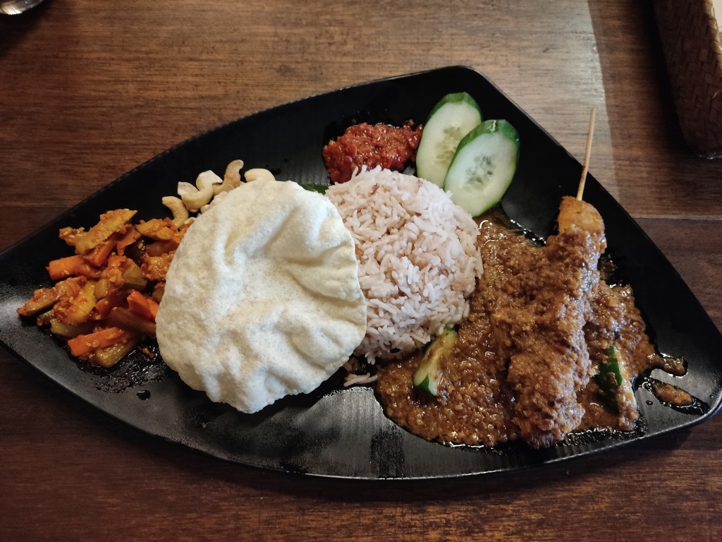 Nasi lemak with a satay skewer