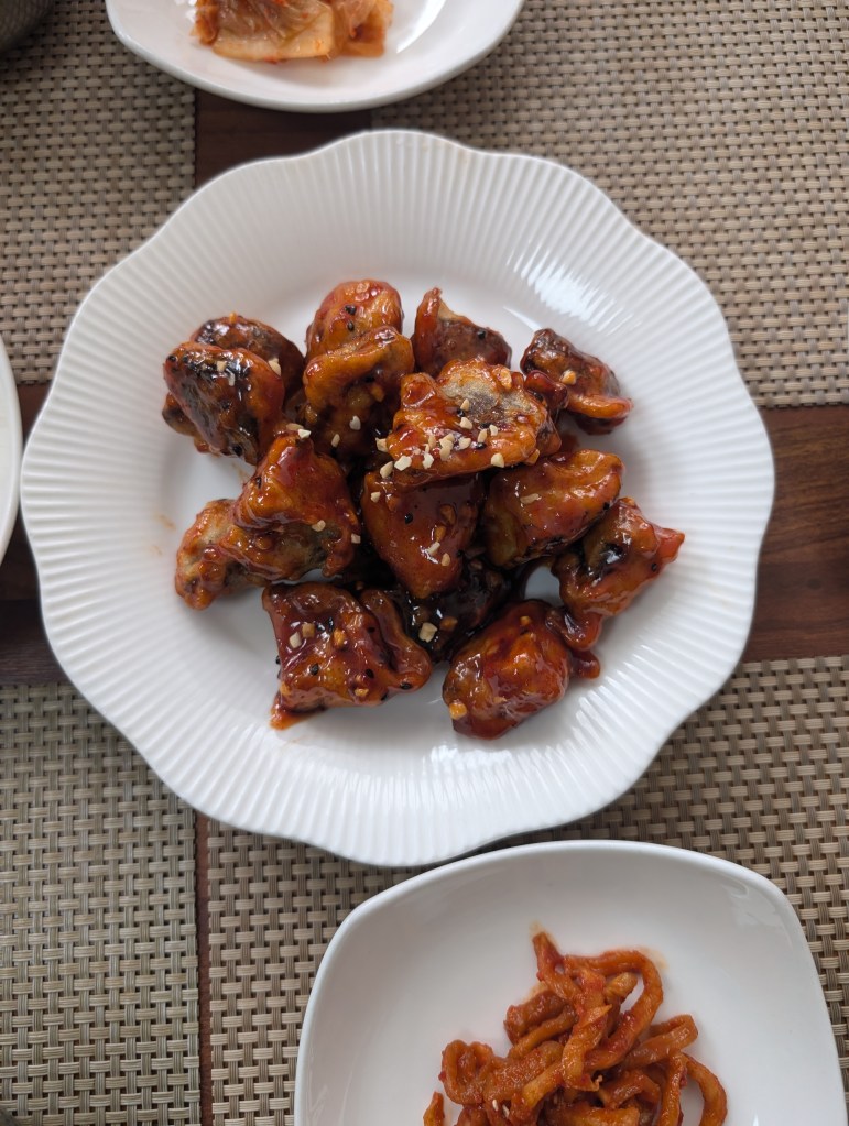 A plate of sticky looking battered mushrooms