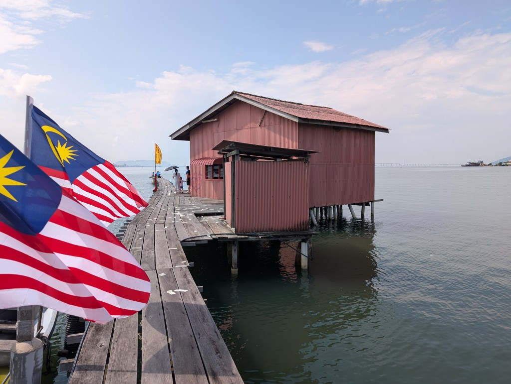 A small building on a jetty