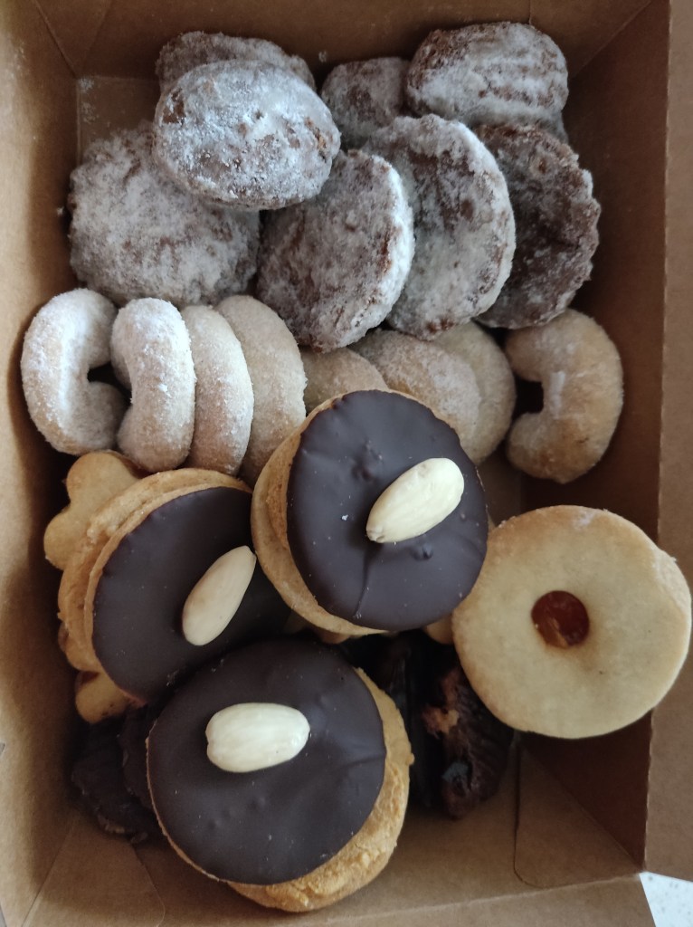A box filled with a variety of different types of biscuit 