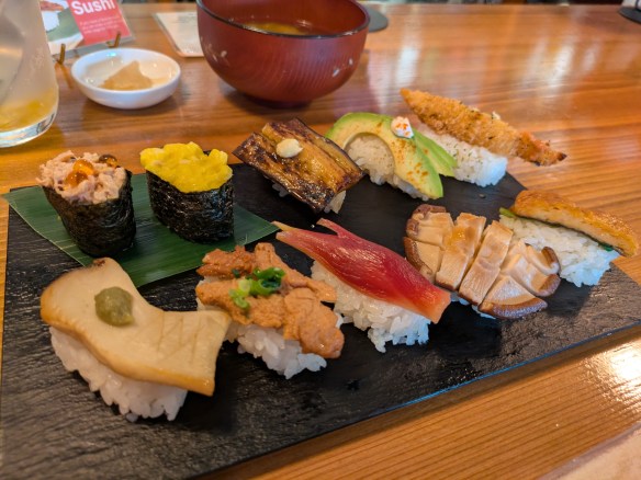 A plate of multiple sushi pieces, each one different