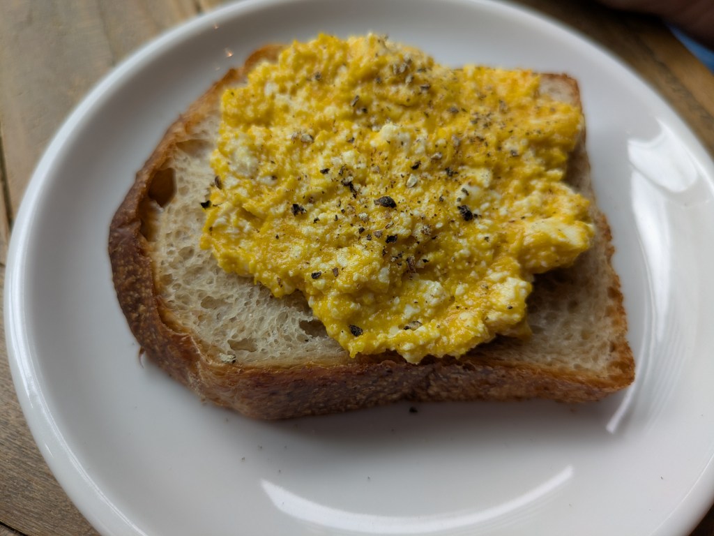 A slice of toast topped with scrambled tofu