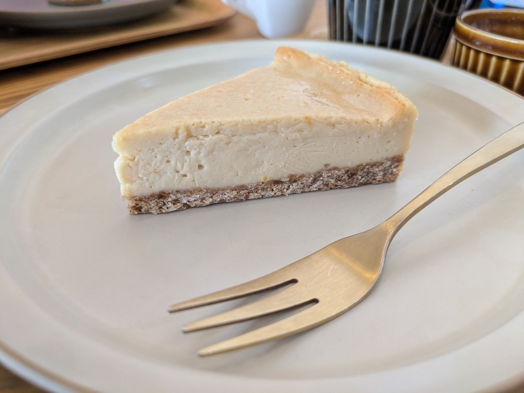 A slice of pale lemon cheesecake
