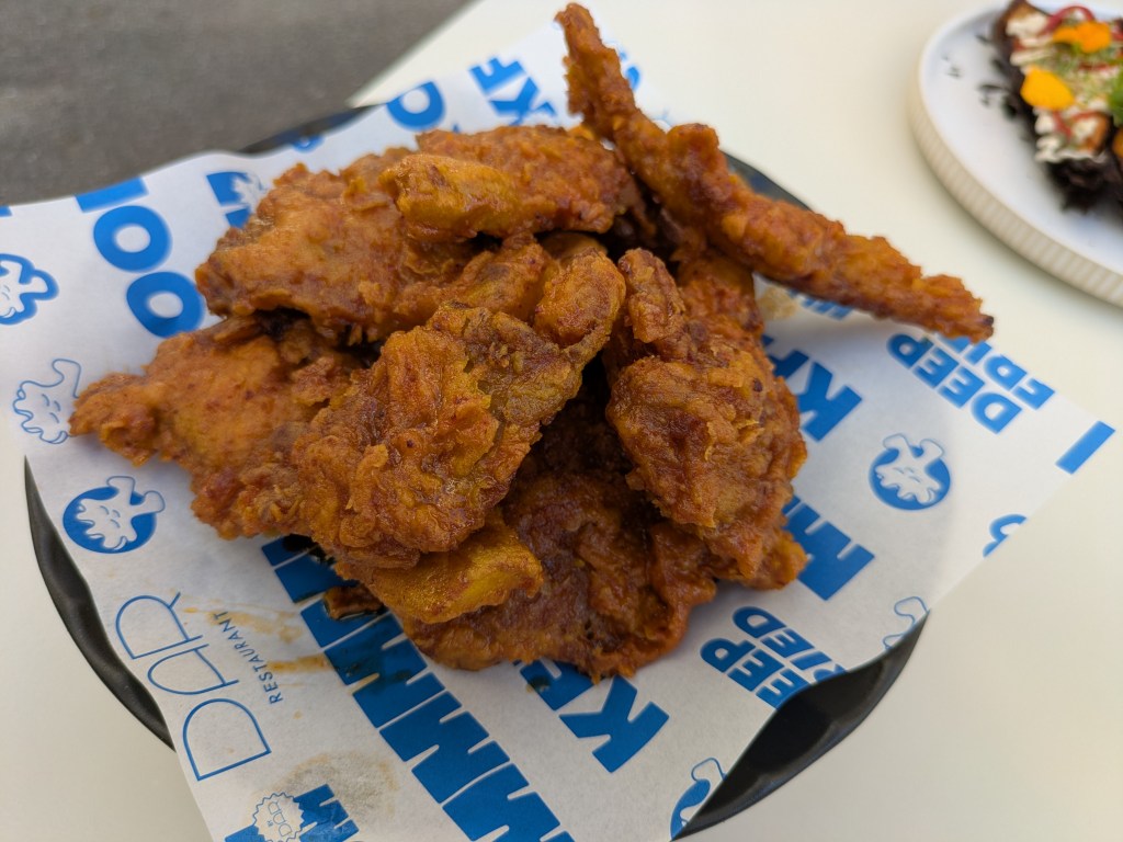 A plate of fried oyster mushrooms in crispy batter