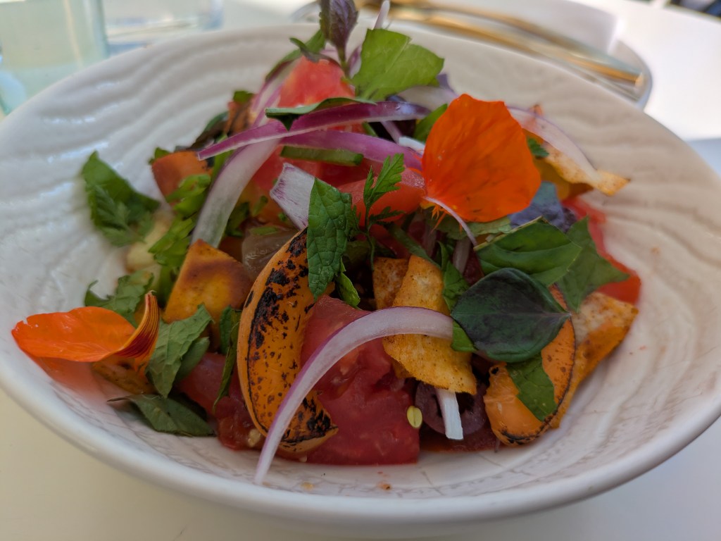 A bowl of colourful tomato salad