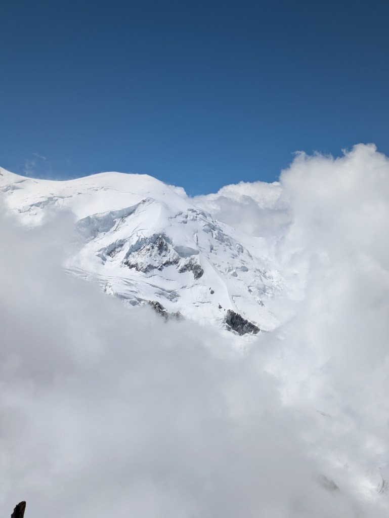 A snowy peak shrouded in cloud