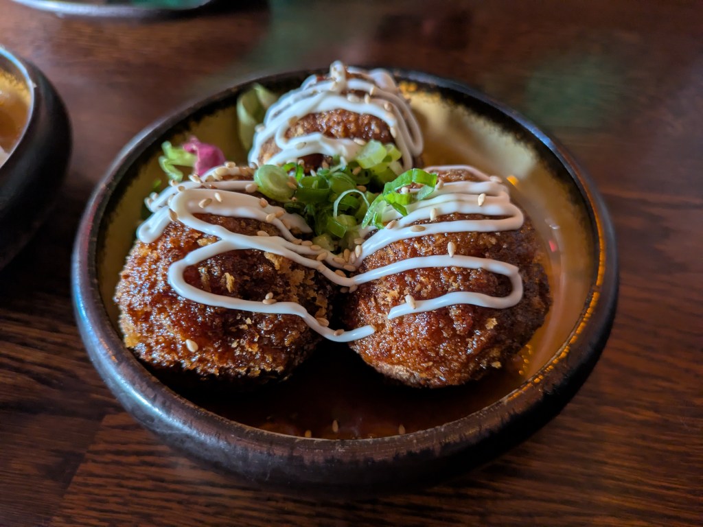 Three pieces of deep fried balls of mock meat