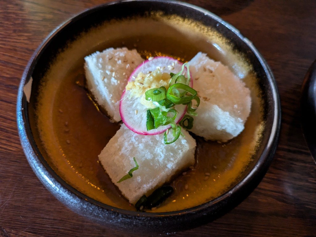 Three pieces of pale fried tofu
