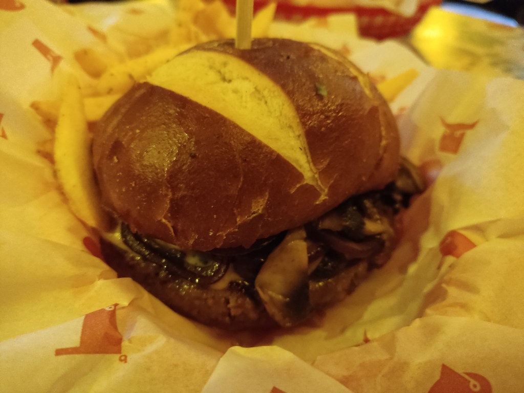 A basket containing a burger and fries 