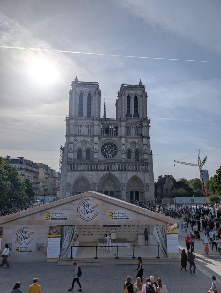 Notre Dame with a baking tent outside it 