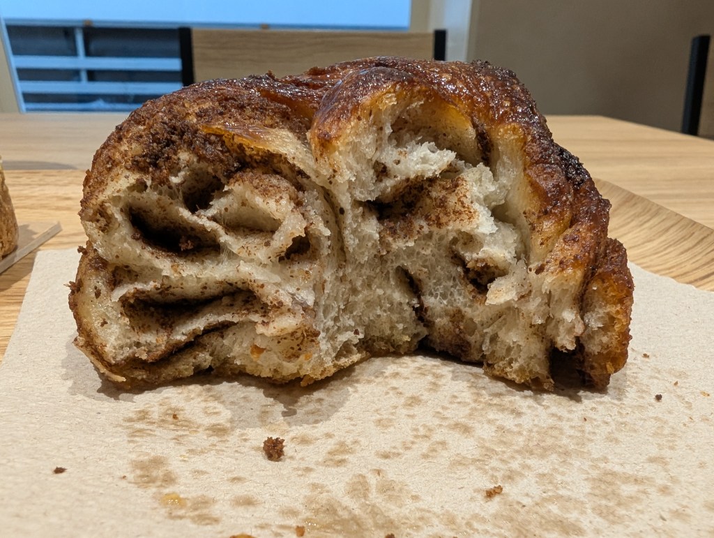 The inside of a cinnamon roll, with lots of spice and sugar running through it