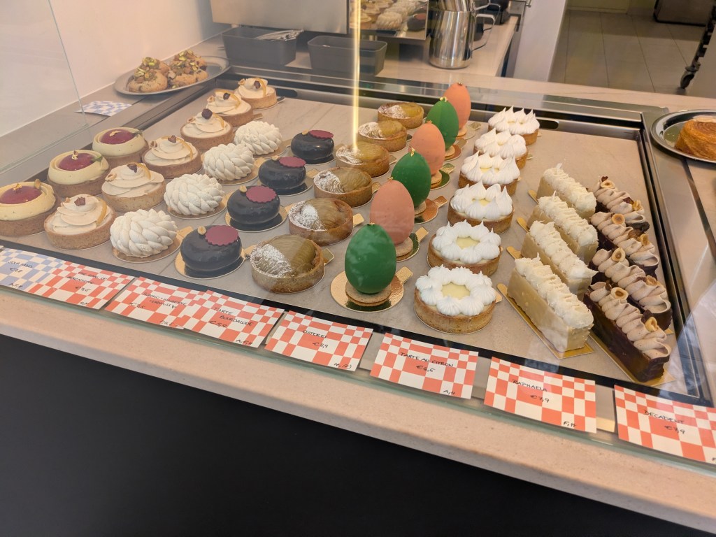 A display case of elegant looking vegan desserts