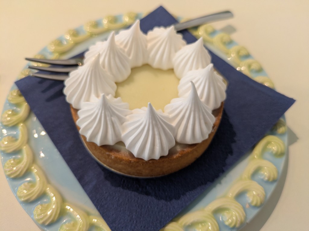 A pastry case topped with a beautiful lemon curd and piped with soft meringue 