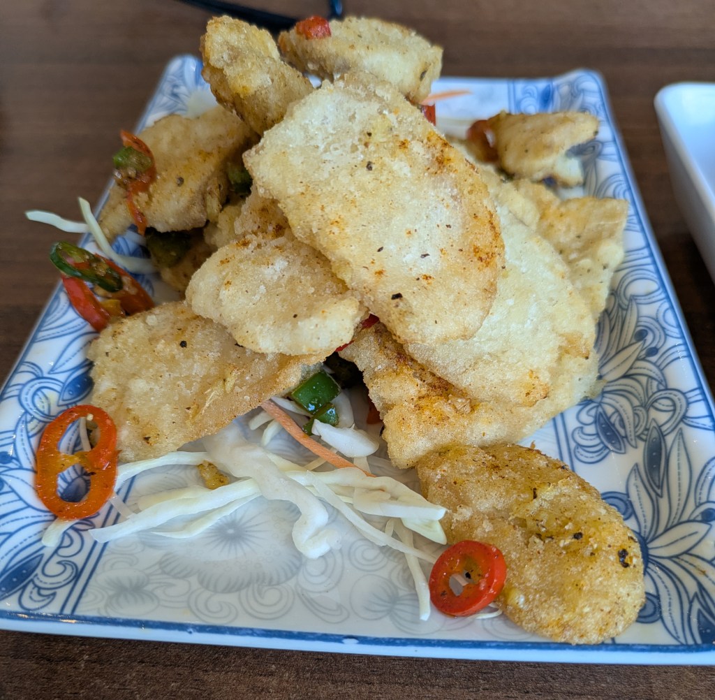 A plate with strips of battered mushroom