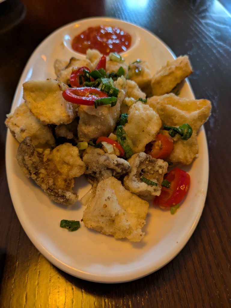A plate of battered mushroom chunks