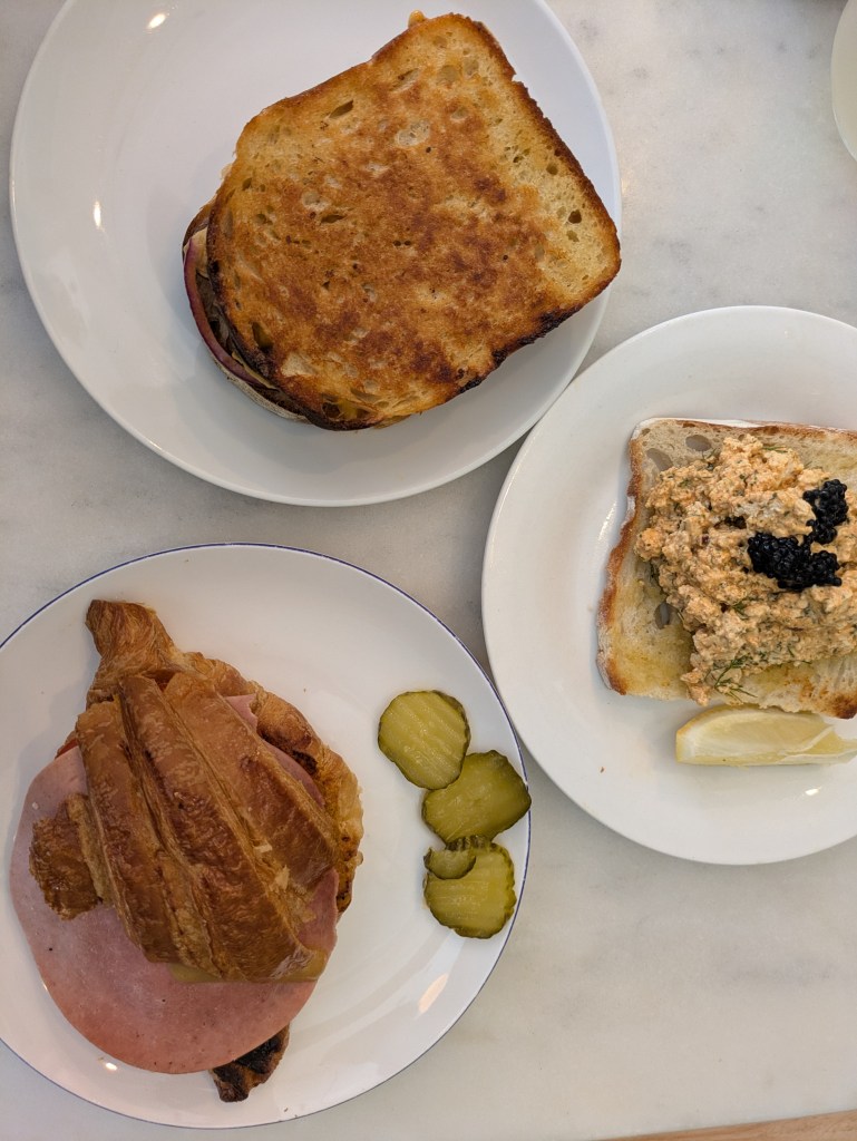 Three different bread based dishes on a table
