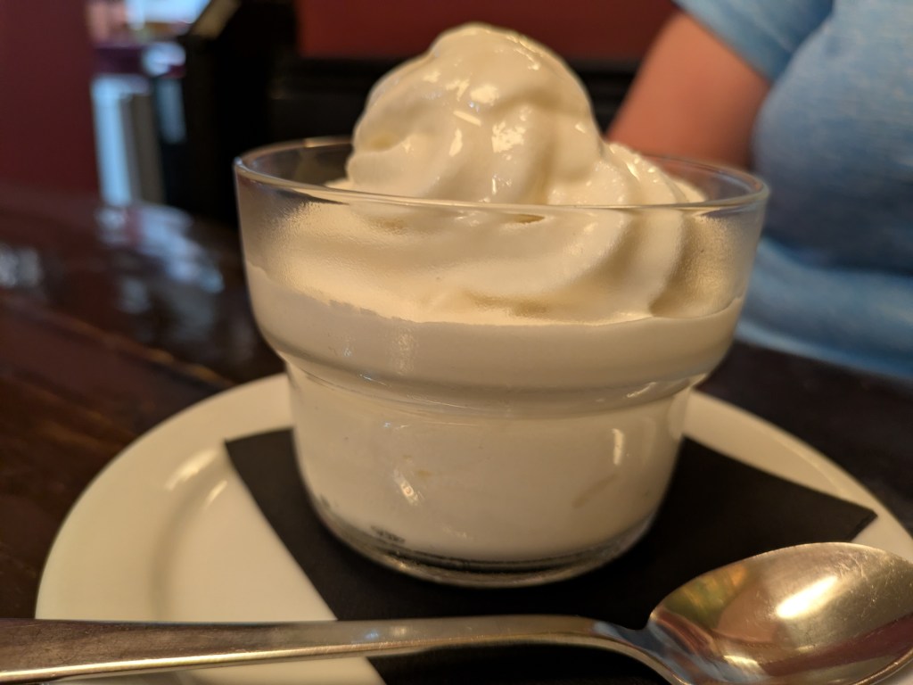 A little glass bowl filled with vanilla ice cream